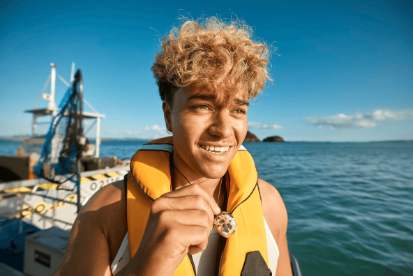 Jade Showing Necklace On Boat